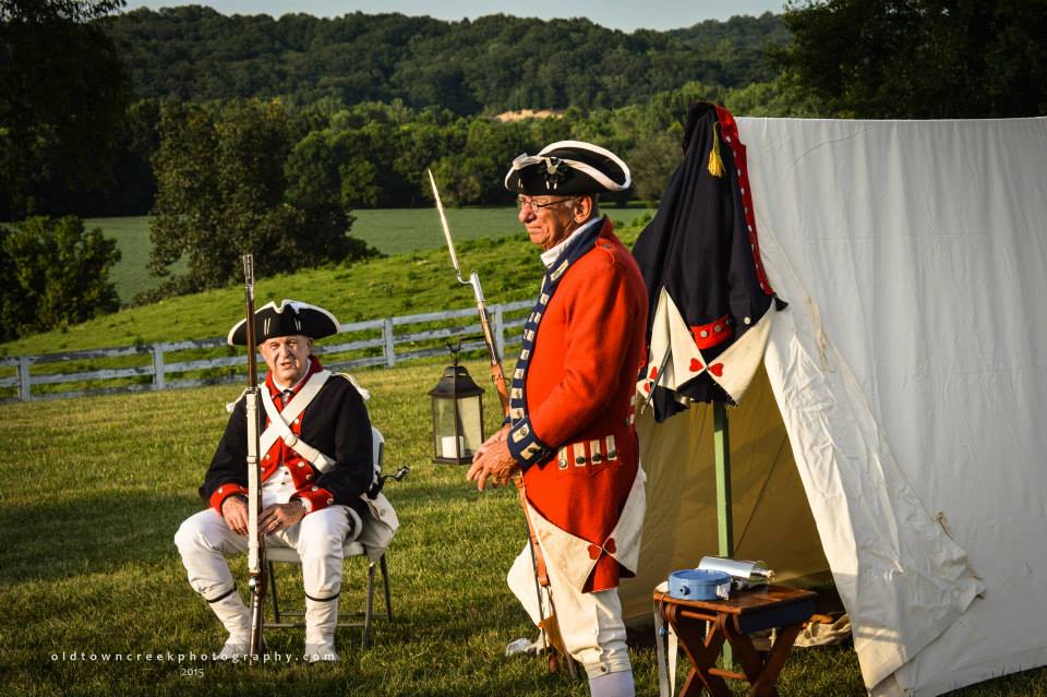 Commander Tom Hankins (R) is wearing an authentic replica of a British “redcoat.” This coat was used in the movie The Patriot.